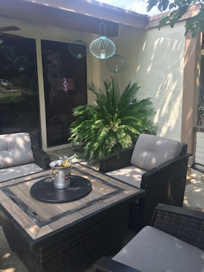 Fire table with swivel chairs to enjoy time on the patio