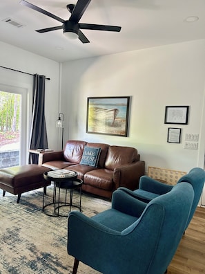 LR with views of the cove side of property and comfortable furniture