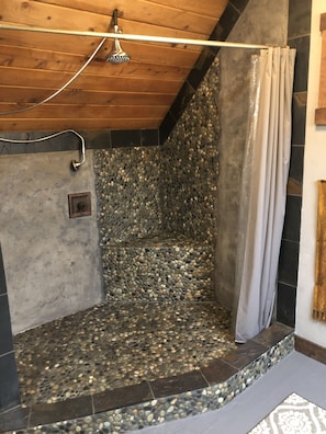Concrete and stone large step in shower