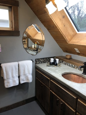 Bathroom vanity w/ copper sink / concrete countertop w/ Mountain view