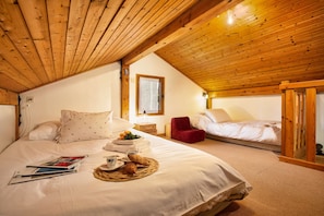 Mezzanine bedroom with double bed and single bed