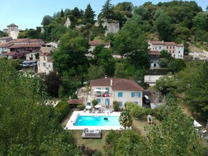 House with backdrop of Chateau d’Aubeterre