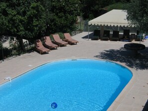 Pool and Raj tent seen from lawn above