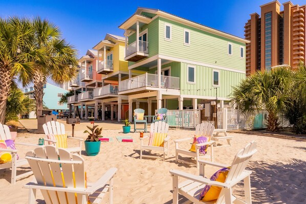 Unwind in our Adirondack chairs perfectly positioned on soft sand for private beach relaxation.