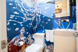 Half bathroom nicely decorated