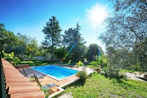 The beautiful outdoor swimming pool available for shared use in the garden.