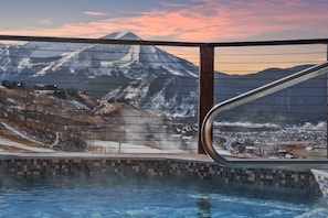 Relax in the hot tub overlooking the slope!
