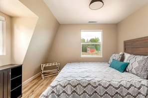 Experience the ultimate retreat in our newly built vacation rental 2nd floor bedroom, offering serene views of Edna Valley's rolling hills from the comfort of a plush queen bed. With a spacious closet for your belongings, you'll feel right at home in this