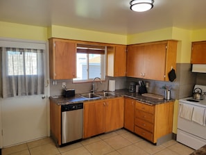 Fully equipped kitchen to allow you to cook at home, order in, or dine out.