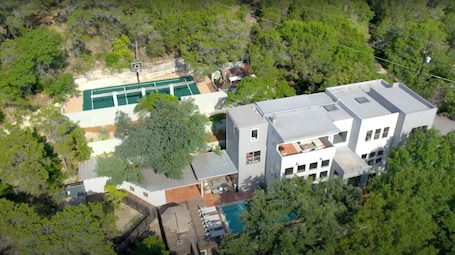 1-acre, 3-story property in Westlake Hills w/ valley views, pool + sport court
