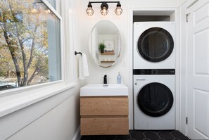 Full Sized Washer & Dryer in full Bathroom with tub/shower combo