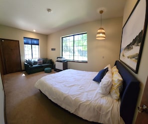 Ground Floor Suite with queen bed, separate bathroom and sitting area
