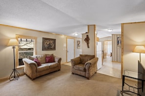 View of Living Room facing the Dining Room, Kitchen, and