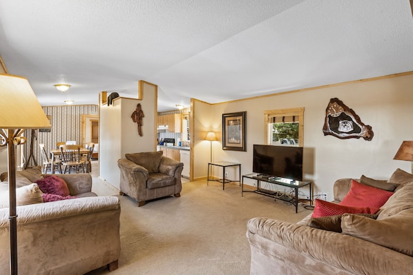 Living Facing the Dining Room Kitchen, and Master Bedroom .