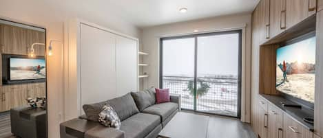 YotelPAD offers the perfect ski in ski out location, watch the snow fall from your 8' sliding glass door oversized windows