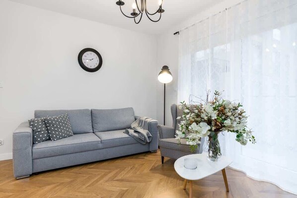 The stylish living room with a comfortable sofa and modern decor.