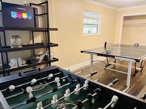 Downstairs game room with foosball and Ping Pong