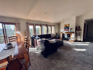 Living room with new carpet and new window treatments