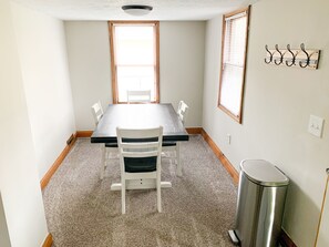 Dining room off the kitchen seats four.