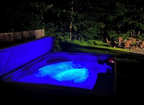 Hot Tub for relaxation looking out into the Vermont woods.