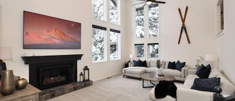 Large living room with incredible large windows to take in the mountains! 