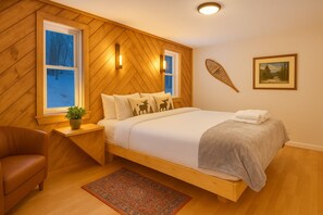 Main floor king bedroom:  Stylish retreat with mountain views, rustic decor, and modern comfort awaits you!