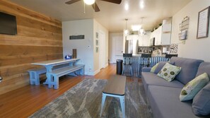 Living Room and cozy breakfast bar with 3 stools