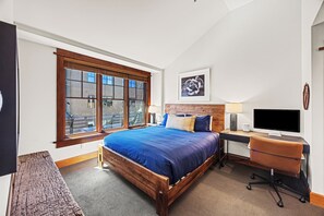 The main bedroom provides king sized accommodations and a dedicated workspace