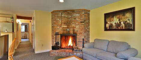 Our cozy one bedroom condo features a homey living area with wood burning fireplace.