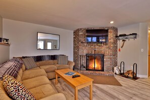 Cozy open floor plan layout and wood burning fireplace