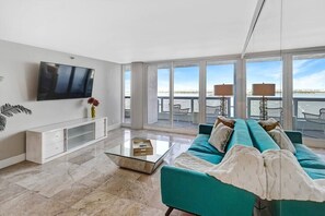 Living room, Roku tv, balcony access, direct water views of Biscayne Bay