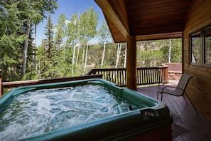 Private covered hot tub with views of the Columbine Lake