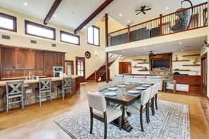 Kitchen bar and dining table with seating for up to 12