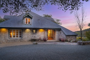 Front of the house at twilight.