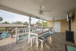 Take Outdoor Living to a New Level – You'll definitely be taking at least some of your meals on the spacious, covered patio. With so many places to relax and the pool nearby, it's sure to be a hit with your whole group.