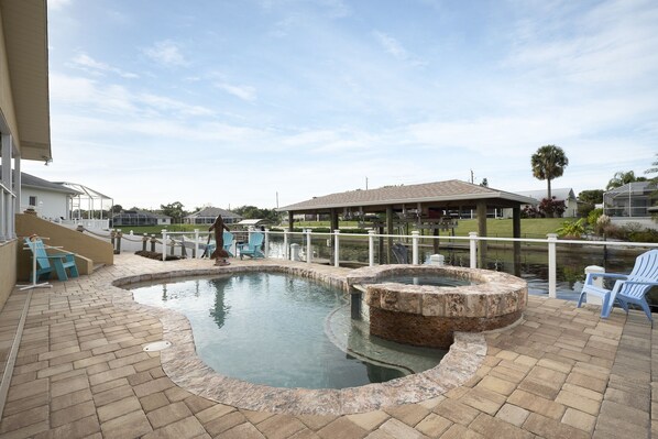 Welcome to Dolphin Cove – Bask in the sunshine and water right in the privacy of your own home (complete with private pool!) located on a saltwater canal.