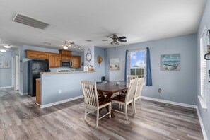 Barn style table with room for 7 guests. Extra chairs in the shed