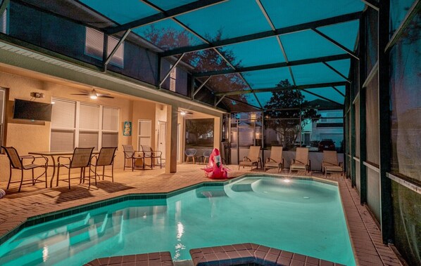 Beautiful pool deck with pool, spa, dining area and loungers