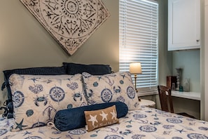Desk area by the queen bed