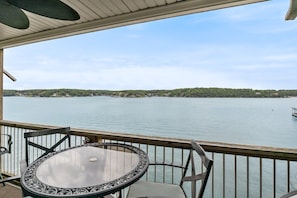 Beautiful view of main channel from deck w/ furniture & propane grill no pm sun