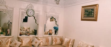 Main living room with traditional Moroccan sofas