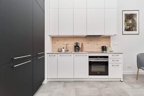 The kitchenette's practical layout maximizes space and functionality.