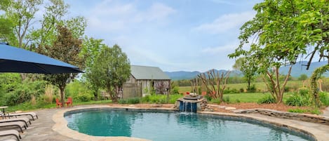 Welcome to Elmwood Acres: an 1890's, 5BR/3.5BA farmhouse situated among hundreds of acres of pastures and orchards with jaw-dropping mountain views, a heated pool, hiking trails, huge yard, and several barns converted into a playhouse and man cave.