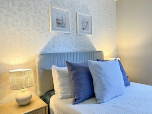 Queen bed. Serena and Lily wallpaper. Sound machine. Blackout blinds.