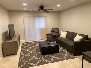 New Lazy Boy recliner and queen sofa provide comfort watching the New 55" LED TV