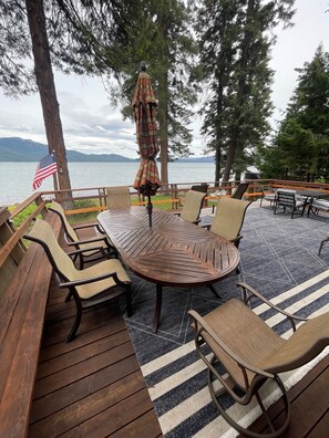 Two large tables on the deck that seat 10.