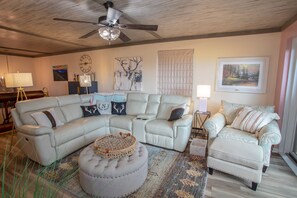 Huge Leather Sectional Sofa, Chair/Ottoman, and Round Ottoman/Coffee Table in Living Room