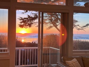 The path to the beach in front of the house, right where those two people are