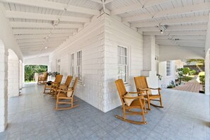 Porch wraps around the Fairhope Avenue and Summit Street corner of the Inn.