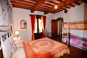 Bedroom 2 with with French doors onto downstairs porch.